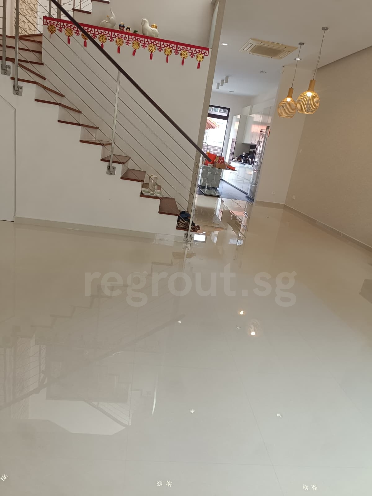 Polyurea grouting applied on bathroom floor tiles for clean white grout lines in Singapore home