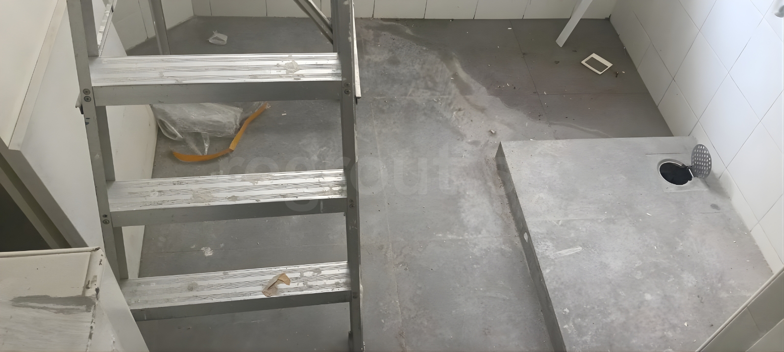 Polyurea grouting applied on bathroom floor tiles for clean white grout lines in Singapore home