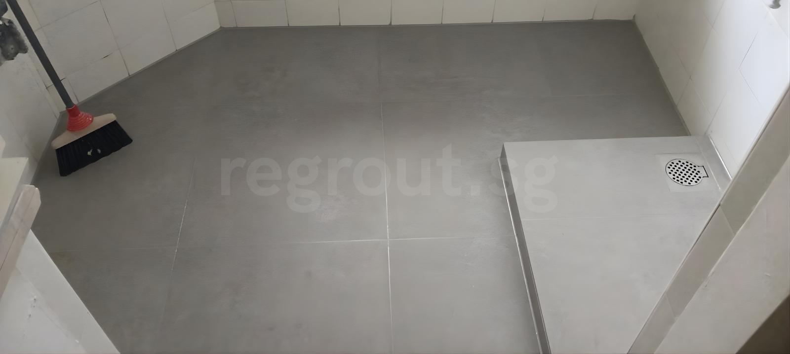 Polyurea grouting applied on bathroom floor tiles for clean white grout lines in Singapore home